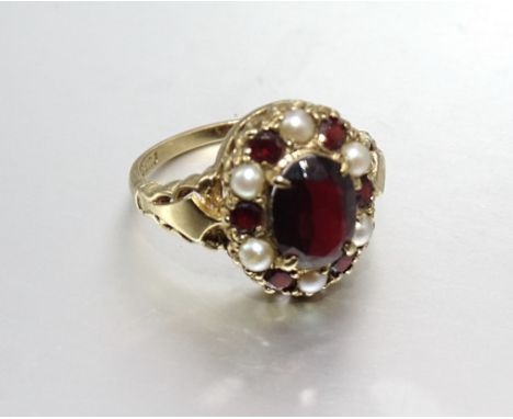 A modern 9ct gold garnet and pearl cluster ring, size O, 4g. 