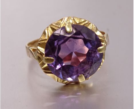 A yellow gold ring set synthetic purple sapphire, bearing Egyptian marks for 18ct gold, size M, 4.3g. 