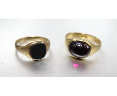 An 18ct gold ring set foiled garnet cabochon, size M, 4.2g and a small 9ct gold signet ring set bloodstone, size H, 1.7g, (2)