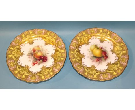 A pair of Royal Worcester comports painted by R Sebright, one decorated with apples and strawberries, the other with peaches 