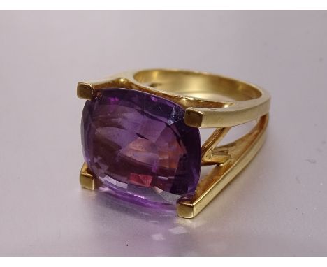 A modern amethyst dress ring, in yellow gold mount bearing foreign marks, tests as 18ct gold approximately, oval amethyst 16 