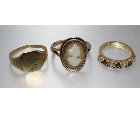 A 9ct gold ring set shell cameo, (worn), size Q, 3.9g, a 9ct gold ring set garnets and synthetic white stones, size J, 2.6g a