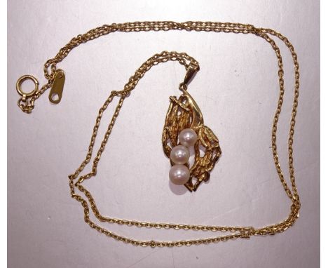 A pearl-set pendant of abstract form, marked '18k', on neck chain marked '18K750', 7.2g. 