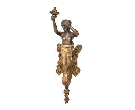 A parcel gilt lacquered brass nude female demi figural gas wall light, late 19th c, of boldly scrolled vine leaves with match