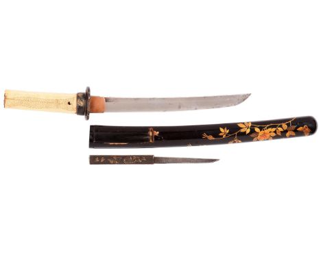 A Tanto in Koshirae Sugata:  Shinogi-Zukuri Iori-mune with shallow tori-zoriNagasa:. 22.5cmMotohaba: 2.3cm Sakihaba: 1.7cm Ka