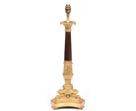 A French ormolu and patinated lamp, 20th c, in Empire style, the acanthus clad pillar on three lion monopodiae, 55cm h exclud