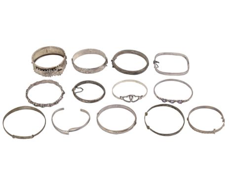 A Victorian silver bangle, 53mm (internal), Birmingham 1883 and twelve other silver bangles, 6ozs (13)  Victorian bangle dama