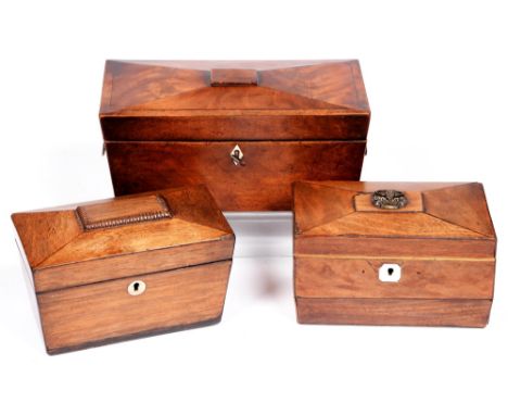 An early Victorian mahogany and ebony line inlaid tea caddy, of sarcophagus shape with fitted interior, 29cm l and two other 