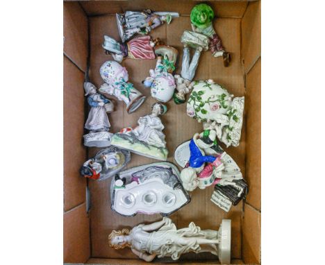 A pair of Continental painted biscuit and glazed porcelain figures of a black boy and girl, c1880, 14cm l and eleven other En
