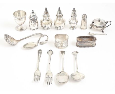 Miscellaneous George V and other silver condiments, napkin rings, flatware and an eggcup, 22ozs 10dwts excluding three items 