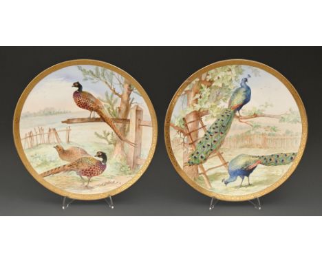 &nbsp;A pair of E J D Bodley bone china plaques, c1890,&nbsp; painted by F Poole, both signed, with peasant or peacocks&nbsp;