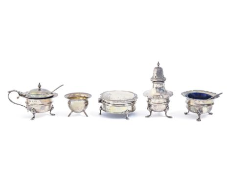 An Edwardian silver condiment set, pepperette 90mm, by John Rose, Birmingham 1908, a silver cauldron shaped salt cellar and a