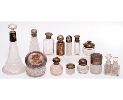 Miscellaneous silver and silver mounted glass jars and bottles, c1900, the plated example embossed with the heads of King Edw