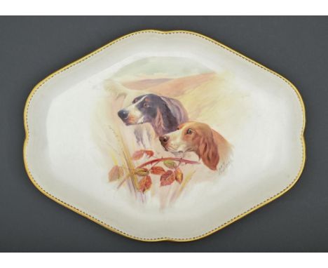 A Minton bone china dressing table tray, early 20th c,&nbsp;painted by J E Dean, signed, with dogs, gilt dentil rim, 30cm l, 