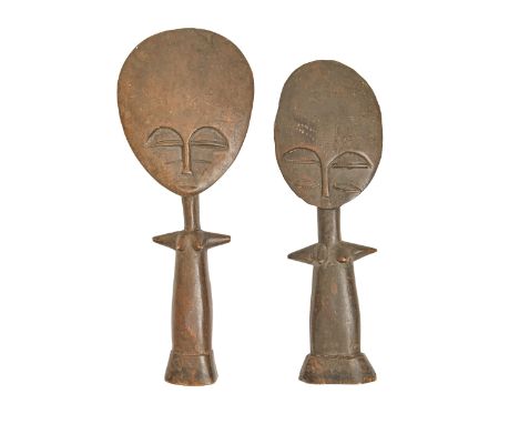 Tribal art. Two Ashanti female doll figures, first half 20th c, with disc head and projecting arms, 26.5 and 29cm  One chippe