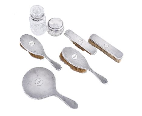 A George V five-piece silver brush set, engine turned and initialled MAJ, maker F &amp; Co, London 1929, a cut glass bowl and