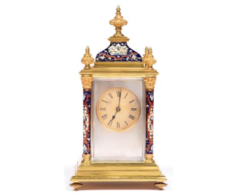 A French brass and champleve enamel carriage clock, early 20th c, with pillars, finials and ogee domed top, striking on a coi