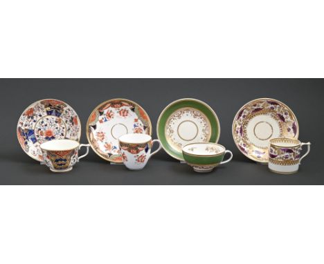A Derby Japan pattern teacup and saucer and puce and gilt coffee can and saucer, c1820, saucers 14cm diam, red painted mark, 