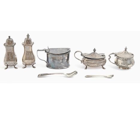 A George V three-piece silver condiment set and two mustard pots, blue glass liners, pepperette 95mm h, by various makers, Bi