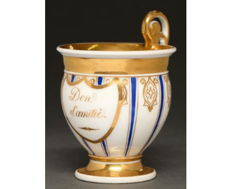 A French porcelain blue and gilt cabinet cup, first half 19th c, inscribed in gilt Don d'Amitie, 11cm h, a German miniature c