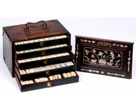 A Chinese mahjong set in mother of pearl inlaid hardwood chest, early 20th c, with bone and bamboo tiles, brass mounts, 16.5c