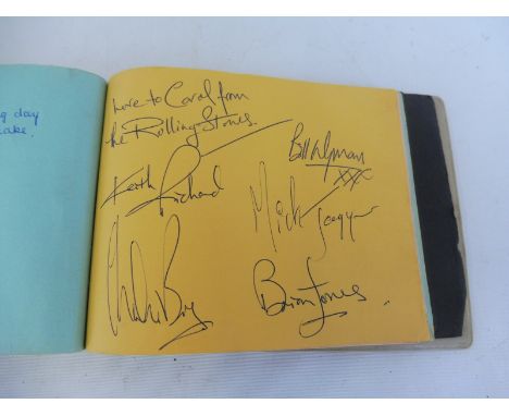 A beautifully presented book with the Rolling Stones signatures, original line up, written in Brian Jones' hand 'To Carol fro