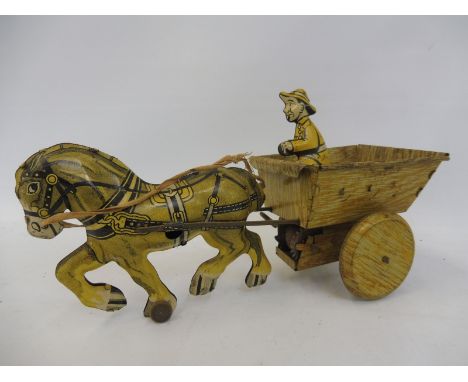 A Marx Toys clockwork tinplate model of a horse drawn cart with occupant.