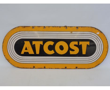 An Atcost enamel sign, 30 x 12". 