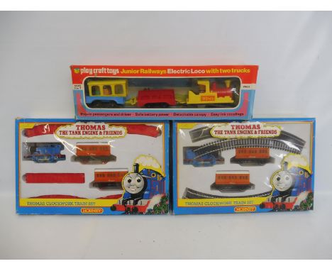 A Haycraft Junior Railways electric locomotive plus two Hornby Thomas the Tank Engine train sets. 