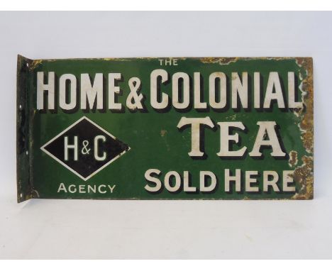 A Home &amp; Colonial Tea Sold Here double sided enamel sign with hanging flange by Patent Enamel, 20 1/2 x 10". 