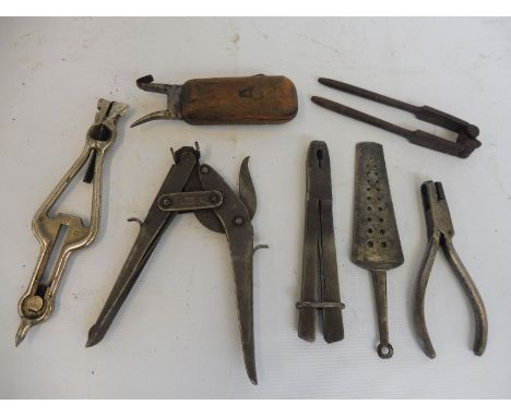 A selection of early tools including a ticket puncher stamped T Newey BR.