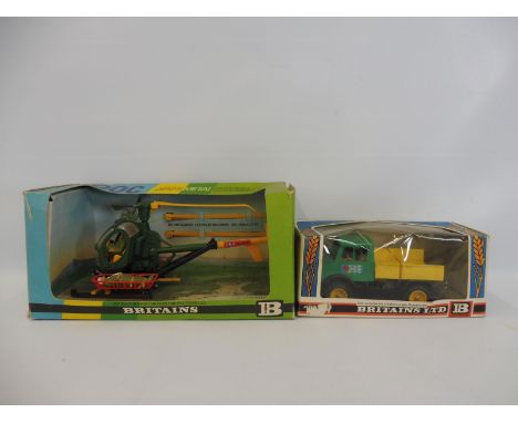 Two Britains circa 1970s models, a Hughes 300c Helicopter , and the Unimog tractor. 