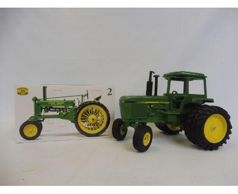 Two John Deere 1:16 scale die-cast farm vehicles, one boxed. 