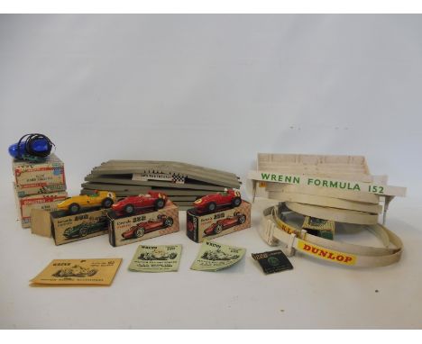 Three boxed Wrenn Formula 152 racing cars, plus a quantity of circuit, accessories etc, plus two boxed Scalextric hand thrott