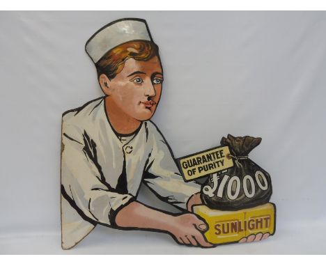 A Sunlight Soap £1000 Guarantee of Purity pictorial die-cut enamel sign depicting the 'baker boy' facing right, restored, 32 