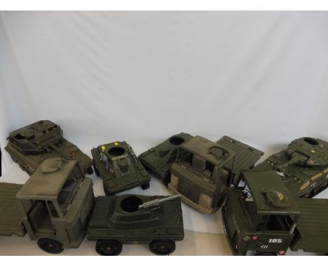 Original Action Man - a quantity of vehicles to include lorries, scout cars and tanks.