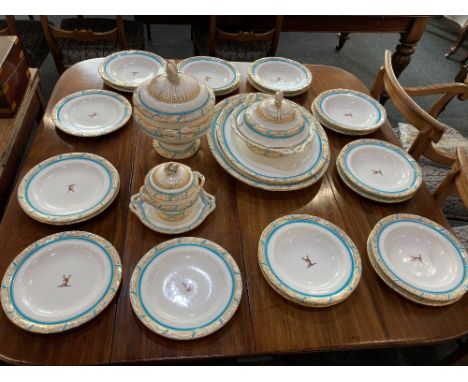 A 19th century Royal Worcester part dinner service, decorated with deer crest and turquoise and gilt borders, comprising thre