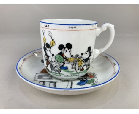 A Royal Paragon China Mickey Mouse series teacup and saucer, the cup stating 'Let's be as happy as we can all day long', Walt