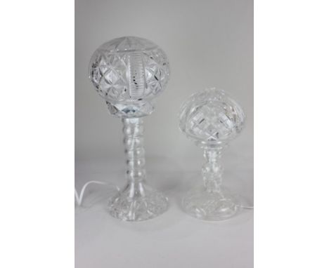 A cut glass table lamp, with glass base and globular glass shade, 45cm high, and another similar, 32cm high (a/f)