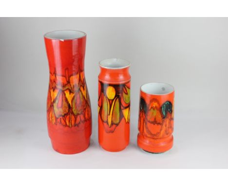 Three Poole pottery Delphis vases, with abstract decoration on orange ground, tallest 40.5cm high (a/f)