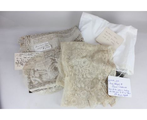 A finely worked lace shawl or veil, with paper note inscribed "Limerick lace. Once belonged to Queen Adelaide, given to her L