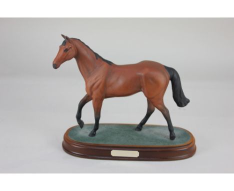 A Royal Doulton porcelain model of racing horse Red Rum, mounted on wooden plinth, 20cm high