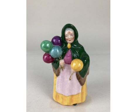 A W. H. Goss porcelain model of a Balloon Seller, initialled EM, Reg No. 69573, 14cm high