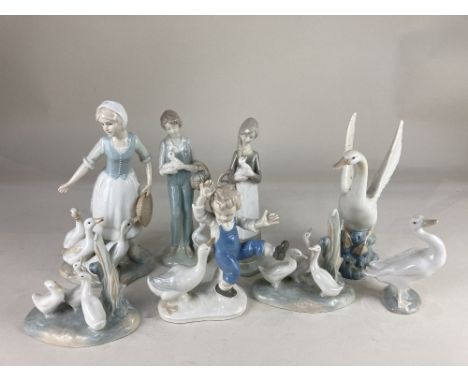 A Lladro porcelain model of a white goose, 12.5cm high, a Grafenthal model of a boy beside a goose, 17cm high, and a pair of 