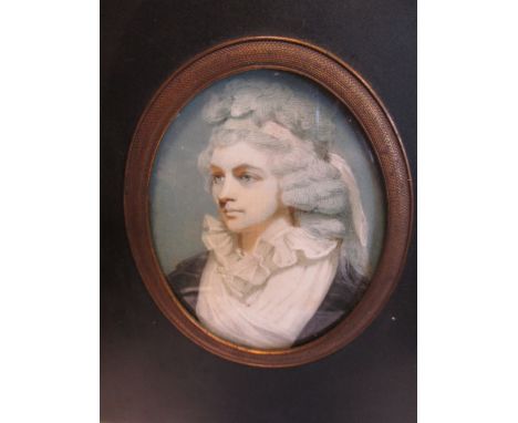 An 18th century miniature of unknown lady, with pink sash in her hair in a papier mache frame  