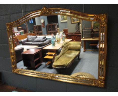 A gilt overmantle mirror 128cm wide  