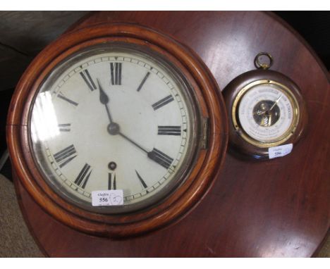 A Rodenstock aneroid barometer together with a wall clock  