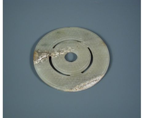 A Chinese jade bi disc, possibly Han dynasty, 8.5cm (3.25 in) diameter  