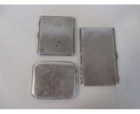 3 silver pocket cigarette cases, the first Birmingham 1938, engine turned all over, 13.5cm (5 1/4in) x 8.5cm (3 1/4in), the s