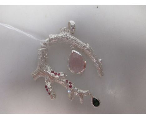 A rose quartz, peridot and ruby pendant, designed as a realistically modelled and textured curved branch, rubover set with ni